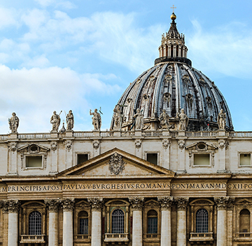 The top of Saint Peter’s Basilica during the day in Vatican City.